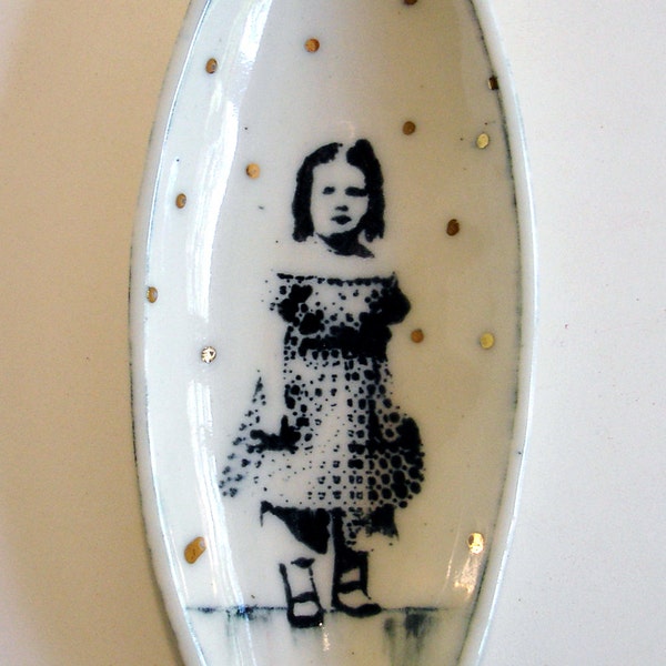small elliptical porcelain portrait bowl with underglaze drawing and gold luster