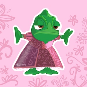 May include: A green cartoon chameleon in a pink and purple dress with a floral pattern. The chameleon has a bored expression, set against a pink background with floral accents. The text "@MINIS" is visible.