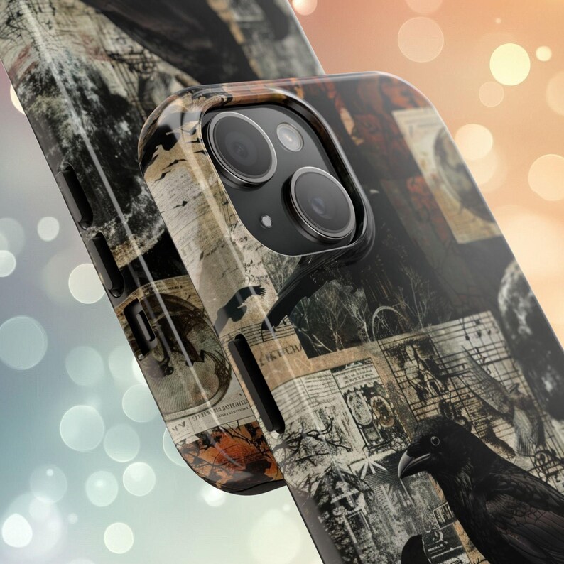 May include: A black phone case with a collage design featuring ravens, vintage paper, and musical notes. The case has a black camera lens cutout.