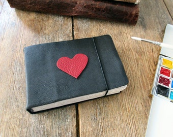 Watercolor Leather Sketchbook Pocket Tome 4” x 6” landscape . black leather red heart . Canson XL multi-media watercolour paper