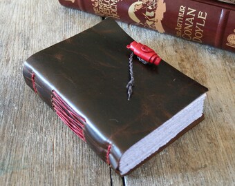 Leather Journal . Bede quote: "I am my own secretary; I dictate, I compose, I copy all myself." handbound . dark brown (320 pgs)