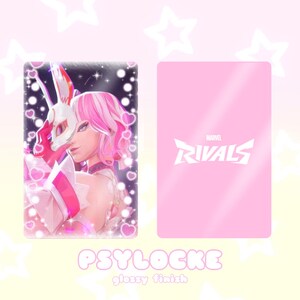 May include: A glossy card featuring a character illustration with pink hair and a white mask, surrounded by hearts. The card's back is solid pink with the "Marvel Rivals" logo. The word "PSYLOCKE" is written at the bottom.