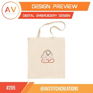 Puede incluir: Una bolsa de tela beige con un bordado de un personaje de dibujos animados gru&ntilde;&oacute;n con una nariz grande, cejas fruncidas y brazos cruzados. El dise&ntilde;o est&aacute; centrado en la bolsa, que cuenta con dos asas superiores para llevarla.