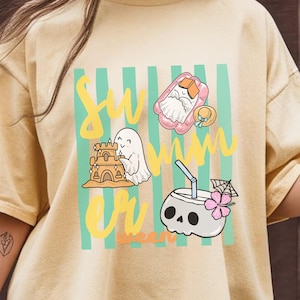 Cute Summerween ghost shirt design with striped background, ghost building sandcastle, ghost on float, skull coconut drink and tropical spooky summer aesthetic