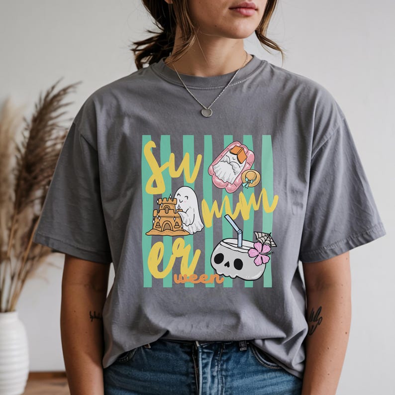 Cute Summerween ghost shirt design with striped background, ghost building sandcastle, ghost on float, skull coconut drink and tropical spooky summer aesthetic