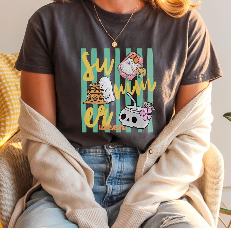 Cute Summerween ghost shirt design with striped background, ghost building sandcastle, ghost on float, skull coconut drink and tropical spooky summer aesthetic