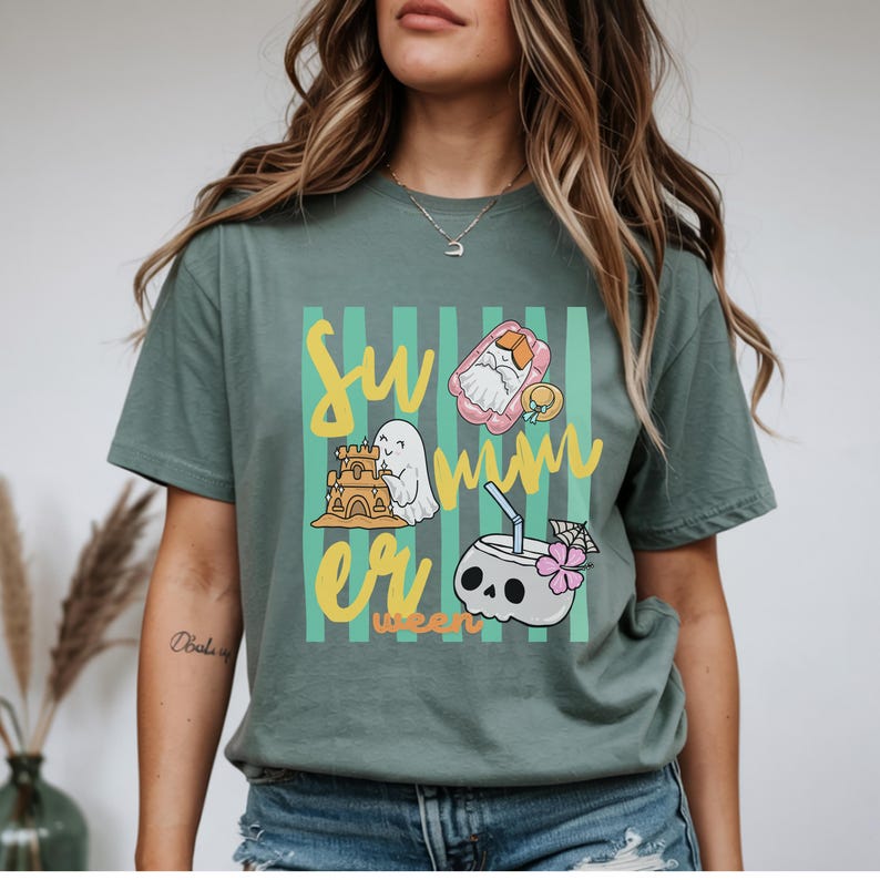 Cute Summerween ghost shirt design with striped background, ghost building sandcastle, ghost on float, skull coconut drink and tropical spooky summer aesthetic