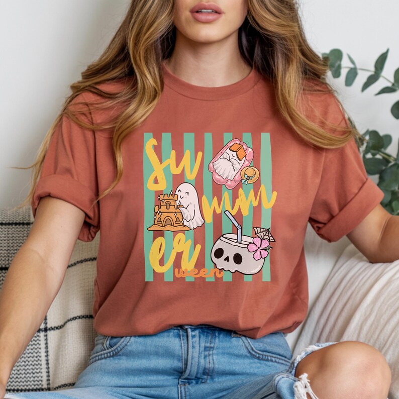 Cute Summerween ghost shirt design with striped background, ghost building sandcastle, ghost on float, skull coconut drink and tropical spooky summer aesthetic