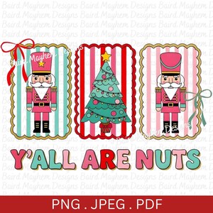 May include: A digital design featuring three Christmas-themed illustrations. Two nutcracker soldiers flank a central Christmas tree. The text "Y'ALL ARE NUTS" is displayed below. The design includes red, pink, teal, and gold accents.