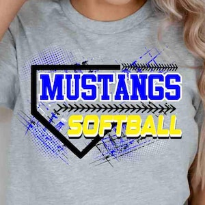 May include: A gray t-shirt featuring the words "MUSTANGS SOFTBALL" in blue and yellow, set within a black and white home plate design. The shirt has blue and yellow accents.