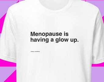 Menopause is having a glow up. Women's midlife humor t-shirt, white