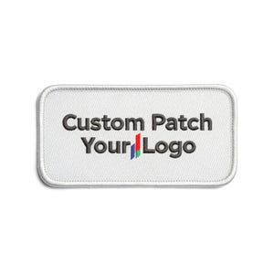 May include: A white rectangular embroidered patch with rounded corners. The patch features the text "Custom Patch Your Logo" in dark gray, with a colorful logo below. The patch has a white border.