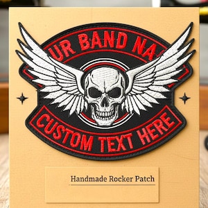 May include: An embroidered rocker patch in black and red, featuring a skull with wings and the text "UR BAND NA" and "CUSTOM TEXT HERE". The patch is displayed on a tan card with the text "Handmade Rocker Patch".