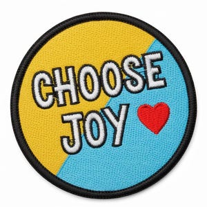 May include: Embroidered patch with the words "CHOOSE JOY" in white block letters. The patch is round with a black border, and the background is divided diagonally into yellow and blue sections. A red heart is on the blue side.