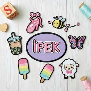 May include: A collection of embroidered patches featuring a ballet slipper, a bee, a butterfly, a bubble tea, two popsicles, a lamb, and a patch with the name "iPEK". The patches are colorful and designed for crafts or clothing.