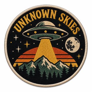 May include: A circular embroidered patch featuring a black background with the text UNKNOWN SKIES in yellow. The design depicts a green UFO emitting a yellow beam over a mountain range and pine forest, with a sunset horizon and a moon in the sky.