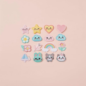 May include: A collection of embroidered patches in various shapes, including stars, hearts, clouds, flowers, a rainbow, a bunny, and cats. The patches feature pastel colors like pink, yellow, blue, and green, with embroidered details and smiling faces.
