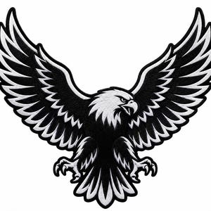 May include: An embroidered patch featuring a bald eagle in flight with wings spread wide. The design uses a high-contrast black and white color scheme, showcasing detailed feather patterns on the wings, a sharp beak, and extended talons.