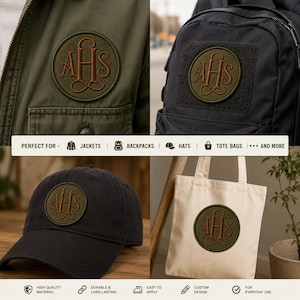 May include: A circular olive green patch featuring the embroidered brown monogram letters AHS in a decorative script font. The patch is shown applied to an olive green jacket, a black backpack, a black baseball cap, and a cream canvas tote bag.