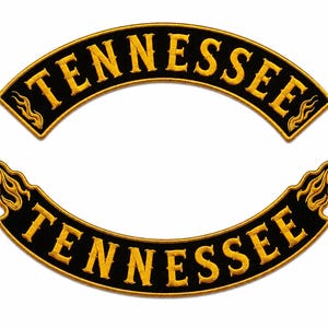 May include: Two black embroidered patches with gold borders and lettering. Each patch is curved and features the word TENNESSEE in a bold font, accented with stylised gold flame designs at both ends of the curved fabric strips.
