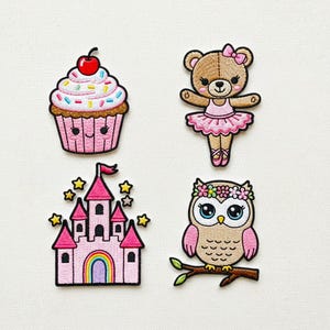 May include: Four embroidered patches: a pink cupcake with sprinkles and a cherry, a brown teddy bear ballerina in a pink tutu, a pink castle with a rainbow, and a pink and brown owl with a floral crown.