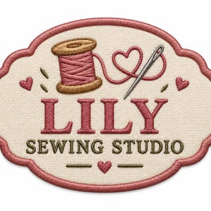 May include: An oval-shaped embroidered patch with a cream-colored background and a pink border. It features a brown spool of pink thread, a silver needle, and small pink hearts. The text LILY SEWING STUDIO is embroidered in pink and brown.