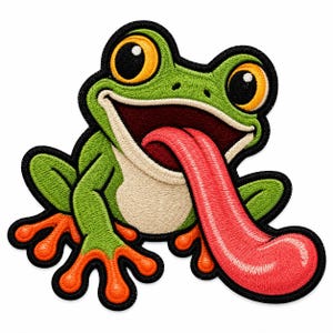 May include: An embroidered patch featuring a green frog with large yellow eyes, a cream-coloured belly, and bright orange feet. The frog has a wide, open mouth with a long, extended pink tongue, all outlined with a thick black border.