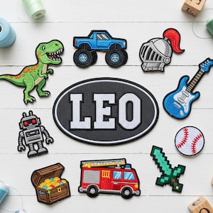 May include: A selection of embroidered patches featuring a green dinosaur, a blue monster truck, a knight's helmet, a guitar, a baseball, a robot, a treasure chest, a fire engine, and a pixelated sword. A large patch displays the name "LEO".
