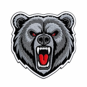 May include: An embroidered patch featuring the head of a snarling grizzly bear. The bear is rendered in shades of gray and black with piercing red eyes, a bright red tongue, and sharp white fangs, all outlined by a thick white border.