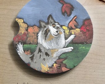 Blue Merle Shetland Sheepdog "Chasing Leaves” Sandstone Car Coaster