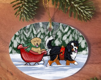 Bernese Mountain Dog & Golden Retriever "A Wintry Ride" double-sided ceramic Christmas ornament by Amy Bolin