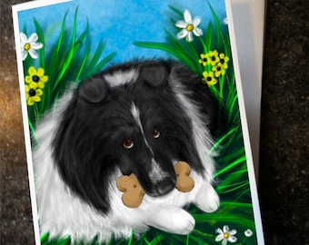 May include: Greeting card featuring a black and white dog with brown eyes, holding two bone-shaped treats. The dog is lying in green grass with white and yellow flowers against a blue sky background. The artist's name and website are in the bottom right corner.
