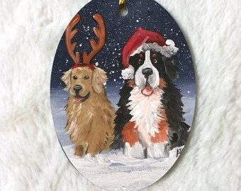 Bernese Mountain Dog & Golden Retriever "Christmas Buddies" double sided oval ceramic Christmas ornament by Amy Bolin