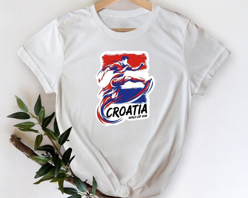 A white t-shirt with a graphic design featuring a person in a fighting stance, along with the text "Crotia" and "World Cup of 2018" printed on it.