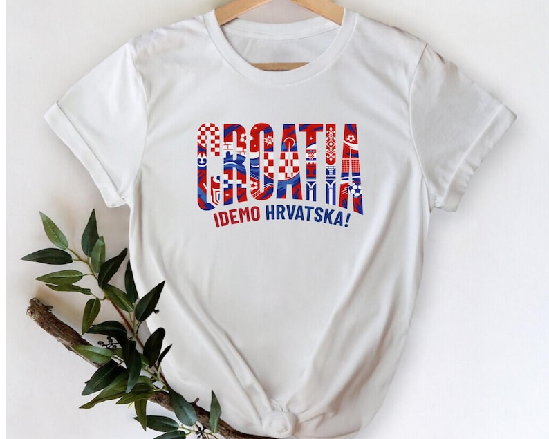 A white t-shirt with the text "Croatia" and "IDEO HRVATSKA!" printed on it, along with a graphic design that appears to be the national flag of Croatia.