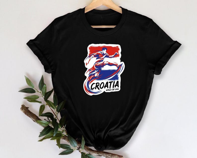 A black t-shirt with a graphic design featuring a stylized figure in red, white, and blue colors, along with the text "Croatia" and "World Cup 2006".