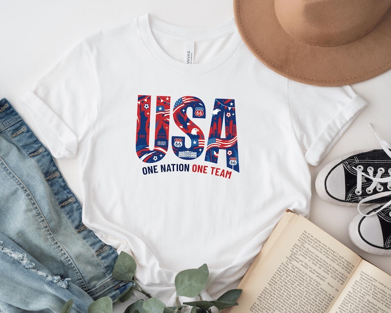 a white t-shirt with a patriotic design, a hat, a pair of jeans, a book, and some sneakers.