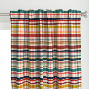 May include: Red, blue, yellow, and green plaid curtain panels with a white background. The curtain panels are made of a soft, woven fabric.