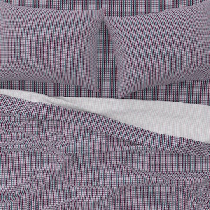 May include: A bed with a white and pink patterned duvet cover and two matching pillows. The duvet cover and pillows have a geometric pattern of small triangles in shades of burgundy, teal, and white.
