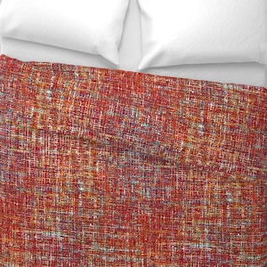 May include: Red, orange, and yellow patterned duvet cover with a textured woven design.