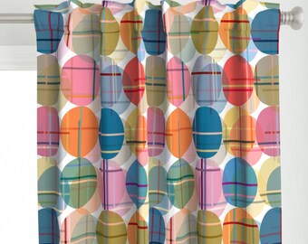 May include: Curtains with a white background and a pattern of overlapping colorful circles with a plaid design. The circles are in shades of pink, blue, green, orange, and yellow.