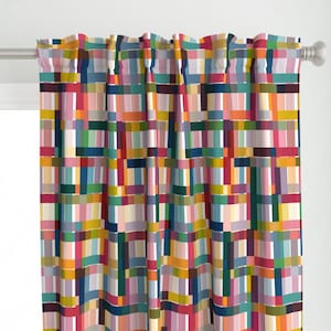 May include: A colorful curtain with a geometric pattern of overlapping rectangles in shades of red, pink, blue, green, yellow, and white.