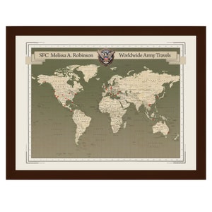 May include: A framed world map with red push pins marking locations. The map is titled "Worldwide Army Travels" and includes the name "SFC Melissa A. Robinson".