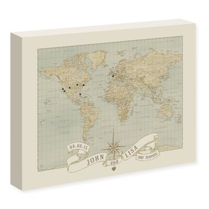 May include: A vintage-style world map with push pins marking locations. The map is on a cream-colored background with a banner at the bottom that reads "06.06.15 JOHN and LISA our travels".