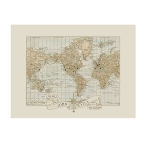 May include: A vintage world map with a light blue background and brown landmasses. The map is decorated with a banner that reads "JOHN and LISA our travels" and the date "06.08.22".