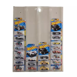 May include: A white display case with two clear plastic doors. The case is filled with Hot Wheels toy cars in various colors and designs. The cars are displayed on a white background with the Hot Wheels logo.
