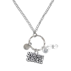 May include: Silver necklace with a charm that says "Nurses Call the Shots!" and other smaller charms.