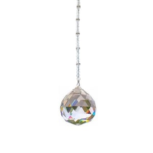 May include: A crystal ball hanging from a silver chain with clear crystal beads. The ball is faceted and reflects rainbow colors.