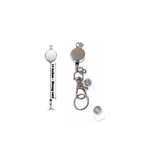 May include: A silver retractable badge reel with a circular housing and a 14 inches strong cord. The device includes a metal lobster clasp, a split ring for keys, and a clear plastic strap with a snap button fastener for attaching identification cards.