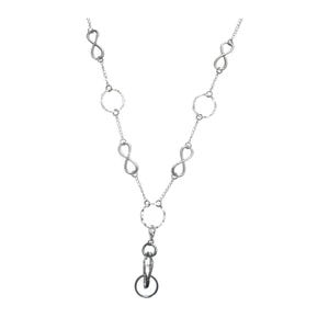 May include: A silver-toned lanyard featuring a chain composed of alternating infinity symbols and textured circular links. The chain leads to a central circular ring connected to a lobster claw clasp and a smaller circular ring at the bottom.